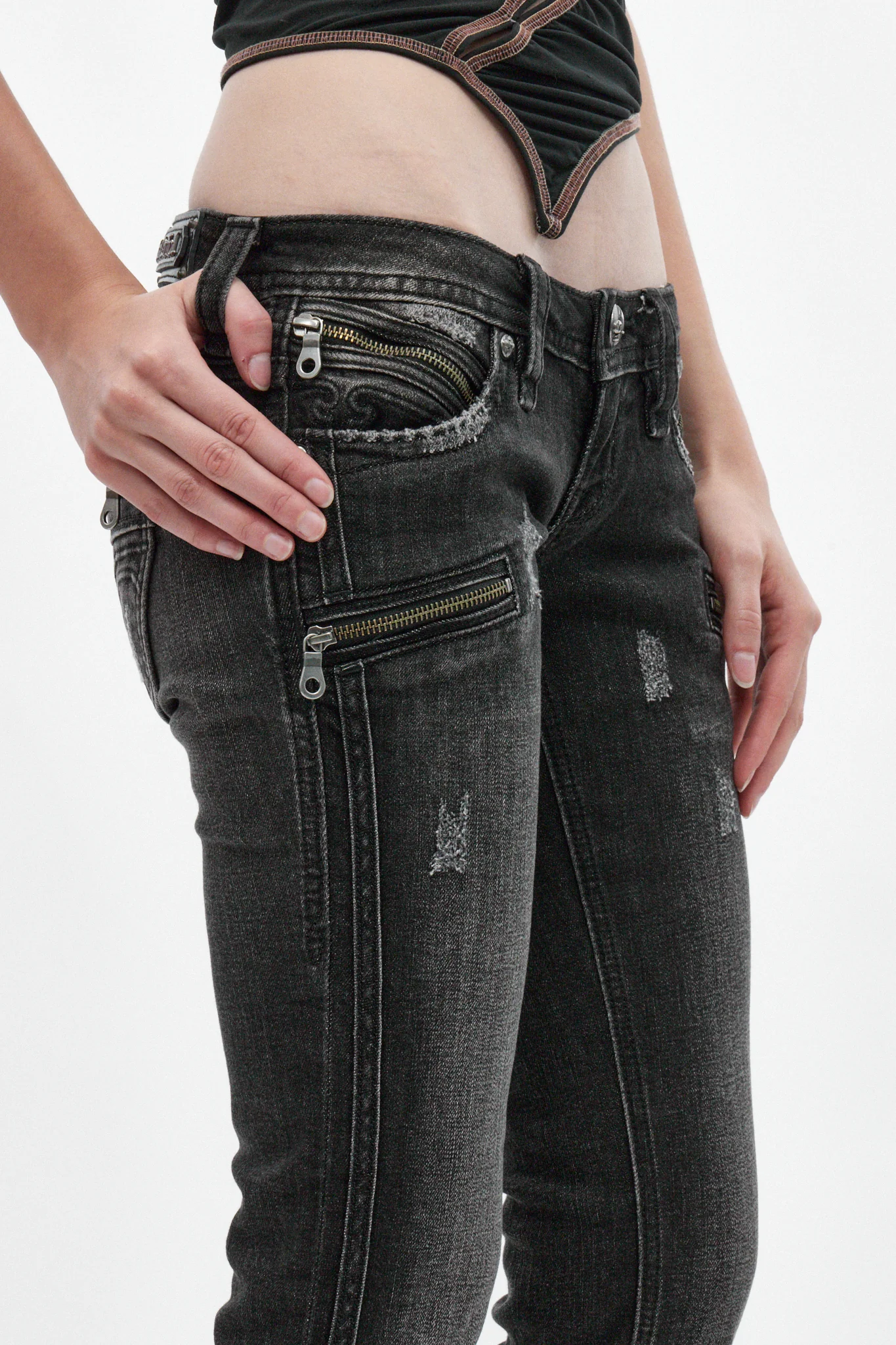 Kamil Super Low-Rise Bootcut Jeans in Faded Black - Image 3